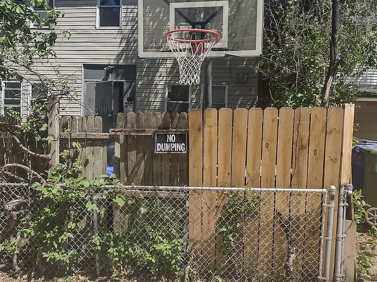 Basketball hoop facing back alley