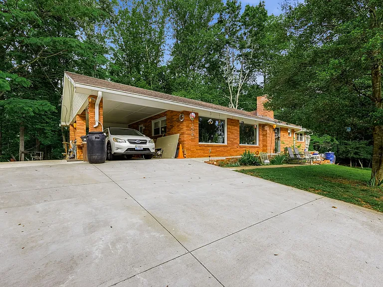 Doublewide Drive (20' Across) and Carport with Parking Pad/Backyard Access
