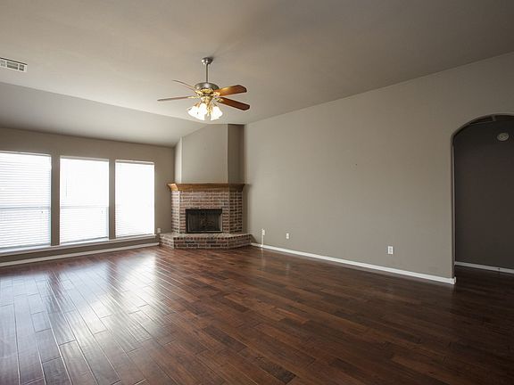 Bright windows and corner fireplace