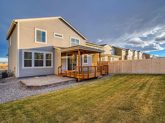 New custom Colorado style outdoor living space! Thick carpet of the healthiest grass.