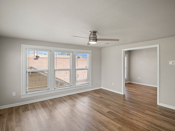 Living Room looking into eat-in kitchen area