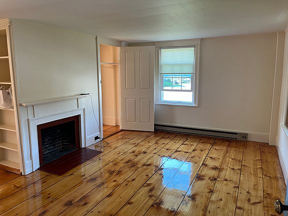 Living Room with inactive fireplace.
