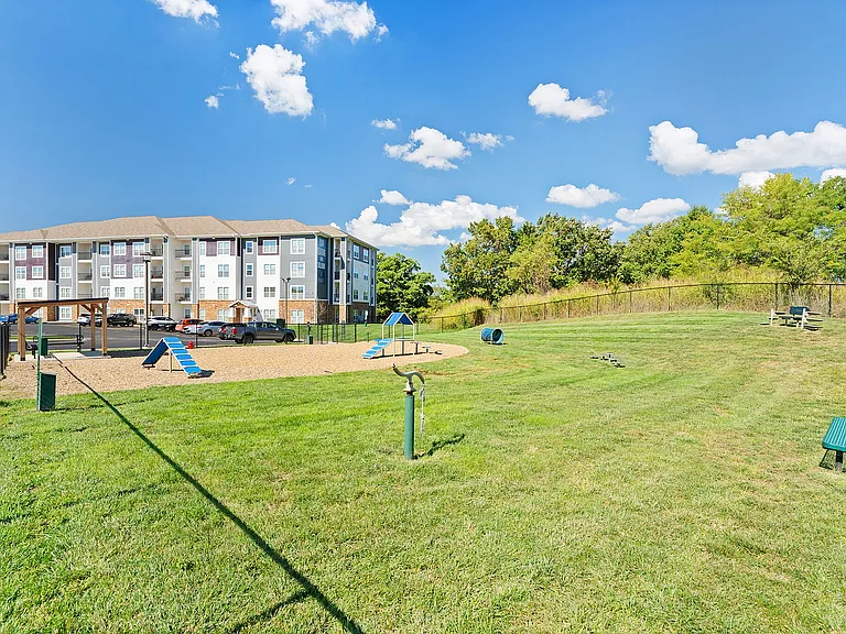 The fenced-in dog park includes agility equipment and plenty of seating for you to watch as your pup plays.