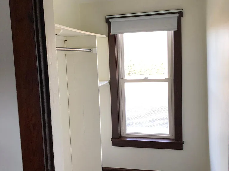 Large, bright, walk-in closet off bedroom