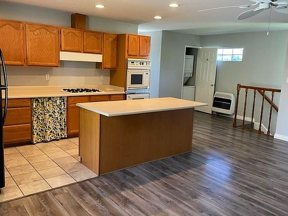 Open concept kitchen w/island and tons of storage. Range, oven, microwave and refrigerator included.