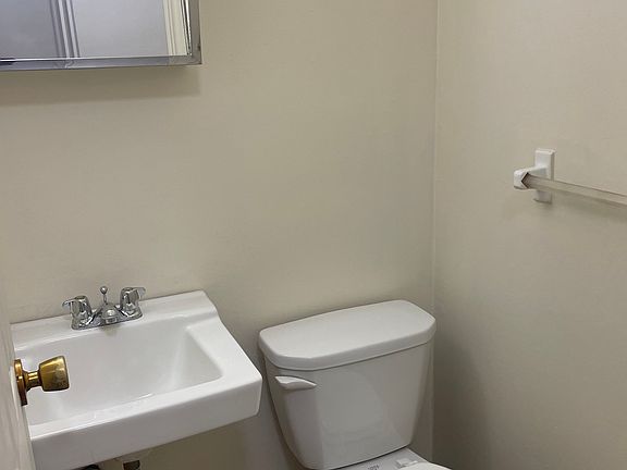 HALF BATH: Not a current photo (old flooring shown)