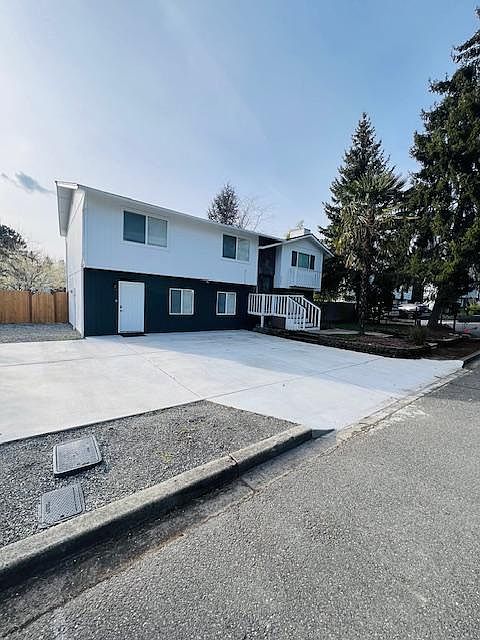 Duplex house with lower and upper unit. The rental is for lower unit only. White door on the ground floor.