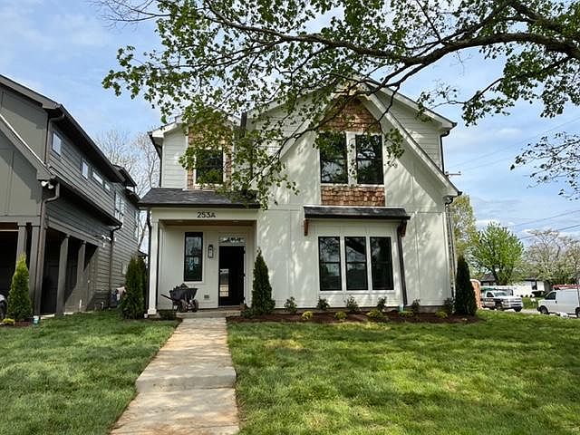 Front yard with mature tree. Corner lot.