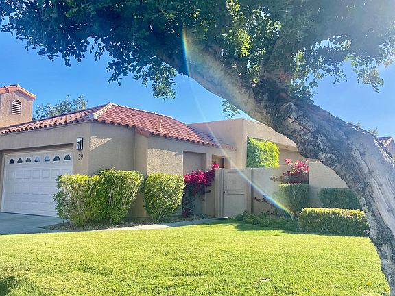 Hello Desert oasis home! Welcome! This is the front and you can see the private gate into your own side yard which takes you to the front door.
