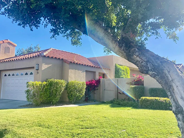 Hello Desert oasis home! Welcome! This is the front and you can see the private gate into your own side yard which takes you to the front door.