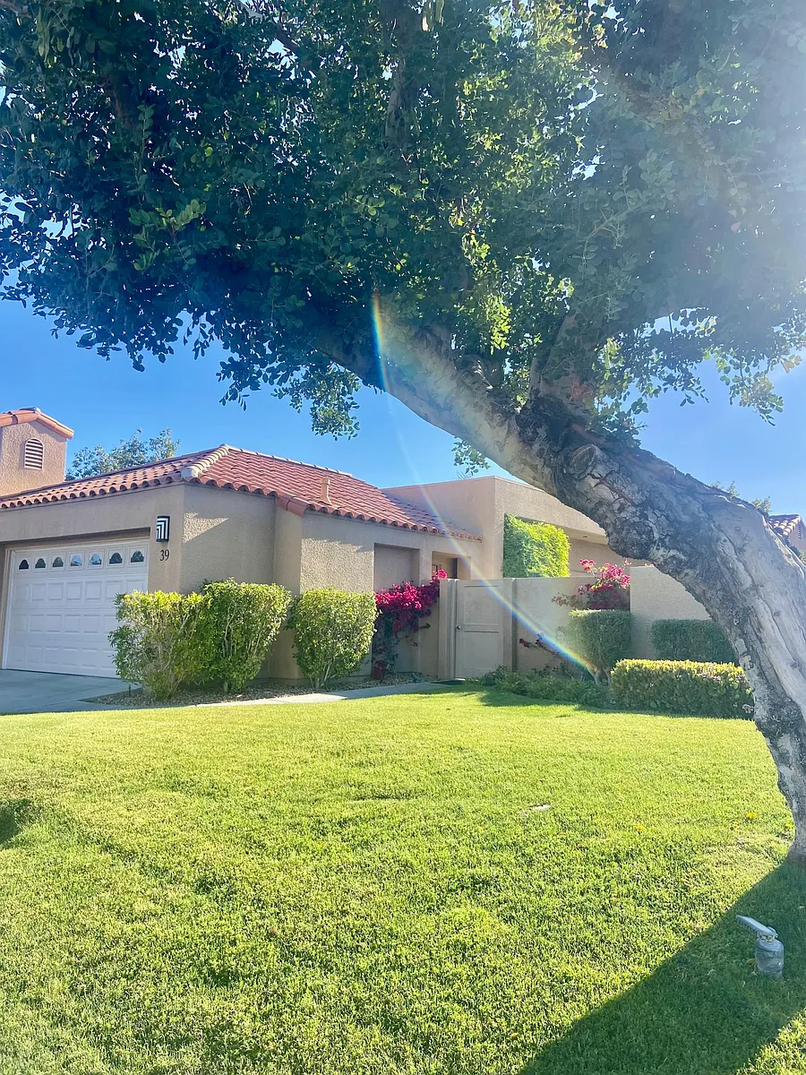 Hello Desert oasis home! Welcome! This is the front and you can see the private gate into your own side yard which takes you to the front door. - Colonial Dr