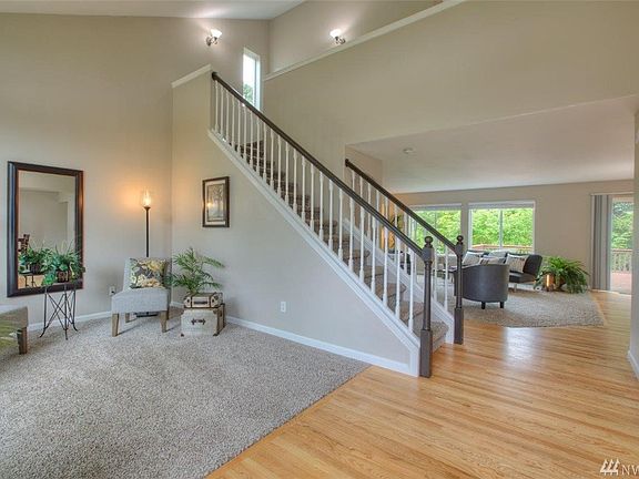 Beautiful extensive hardwoods, newer carpet and two story vaulted ceilings greet you upon entering this Spacious, Updated, 3,000 sq ft home.