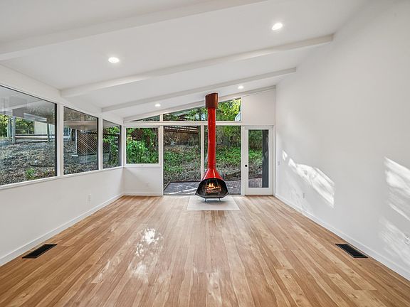 Family Room (wood burning fireplace, patio access)