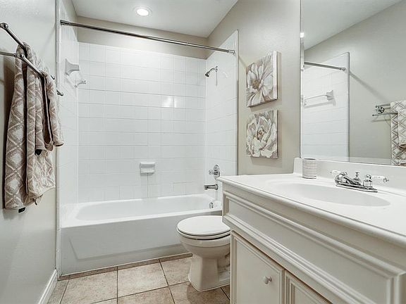 Downstairs full bath. Light and neutral.