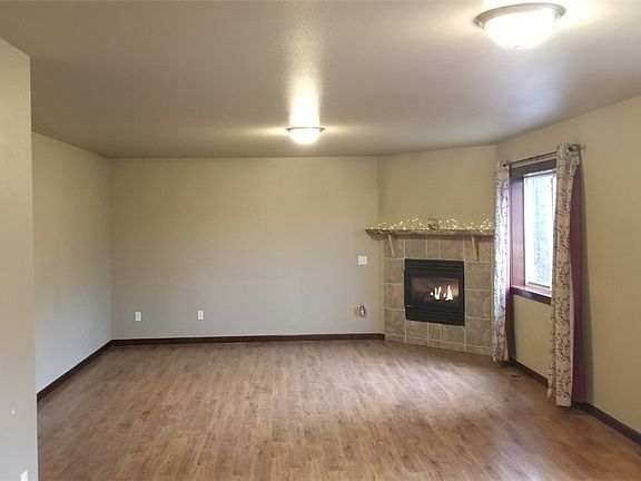 Huge Living/Family room off kitchen. Notice the fabulous wood floors throughout entire main level of the home.