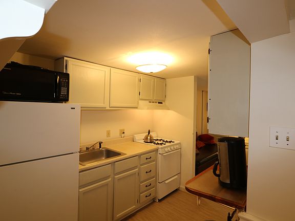 Kitchen has microwave and disposal