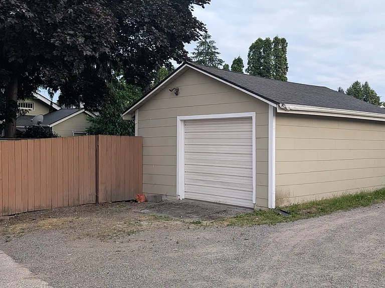 Oversized 1-car garage with new entry door, windows, insulation, interior walls.