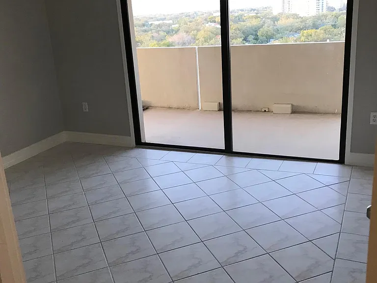 2nd bedroom, large with view, patio access.