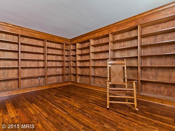 Living Room w/ Extensive Bookcases