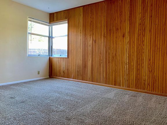 First main floor bedroom overlooking patio and back yard.