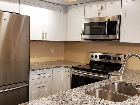Eat-In Kitchen w/Granite Counters, White Cabinets & Stainless-Steel Appliances