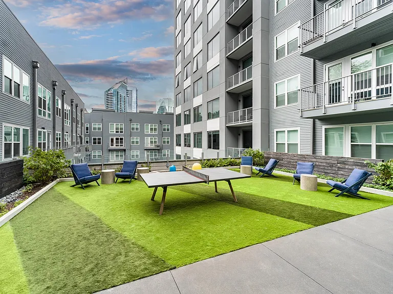 The 4th Floor Terrace at Modera Old Ivy invites relaxed afternoons with lawn games, lounge seating, and skyline glimpses woven into everyday Atlanta living.