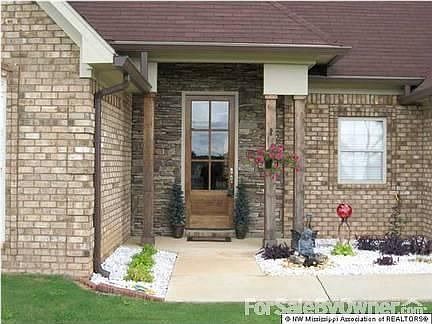 Stone Entrance w/ Beautiful 8 foot door!