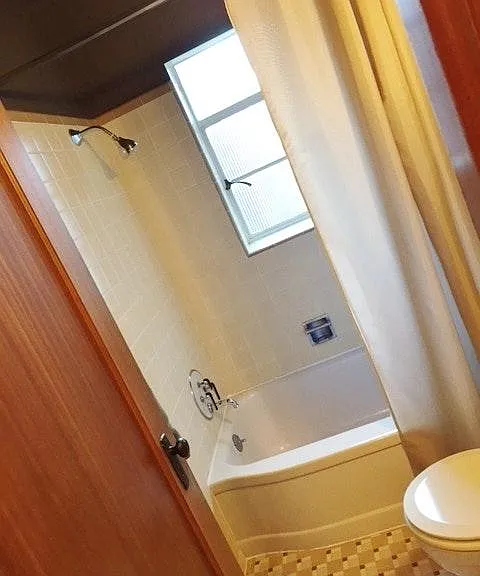 Full-size tub and shower.