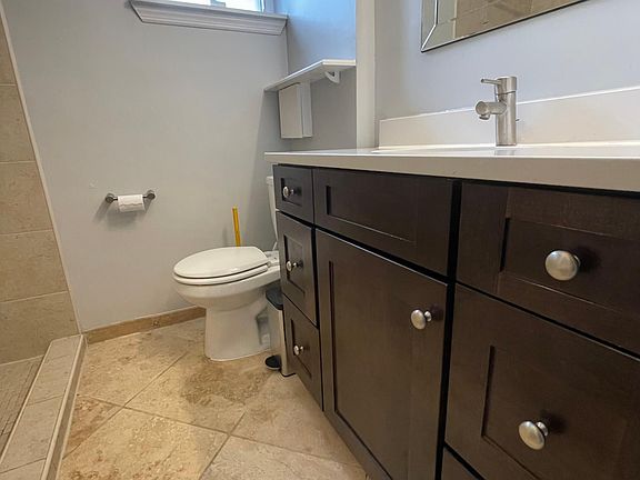 bathroom with shower and ample storage
