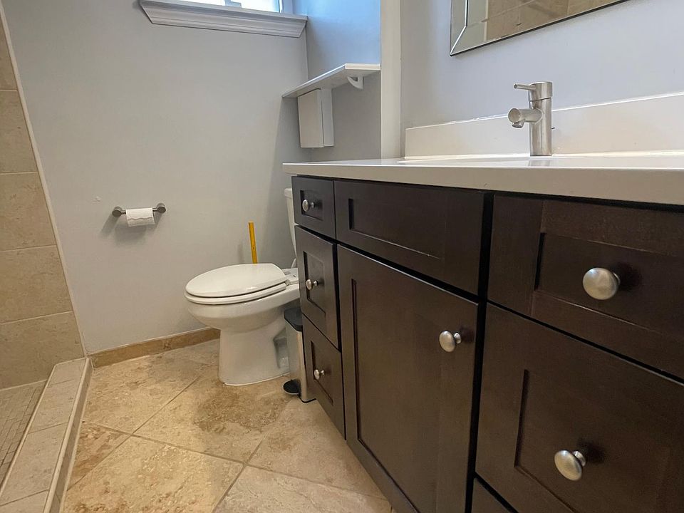 bathroom with shower and ample storage