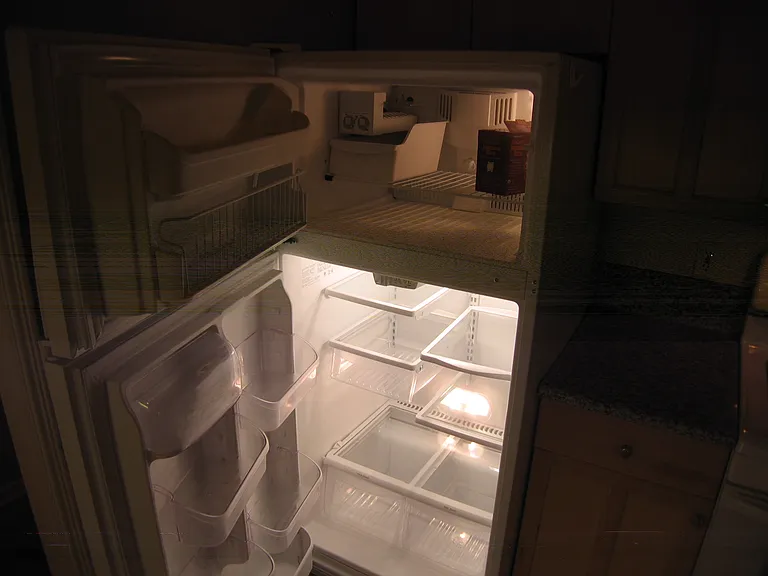 Typical refrigerator with ice maker.
