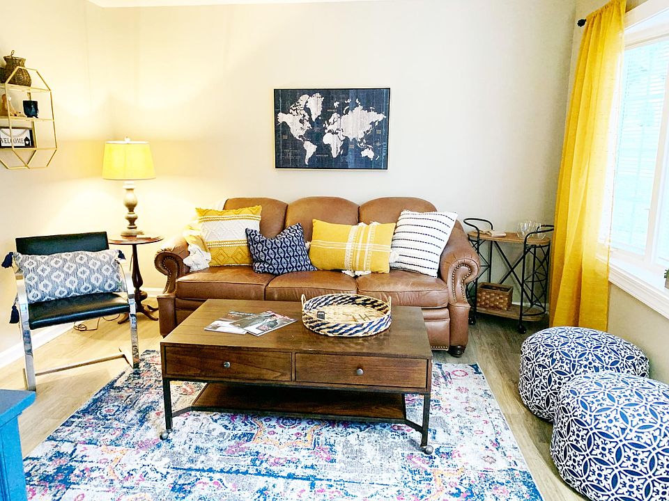 Bright and cozy living room with bar cart