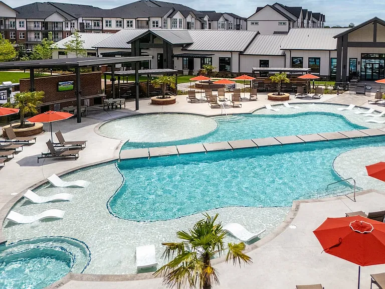 Resort-style pool with poolside lounge and cabanas