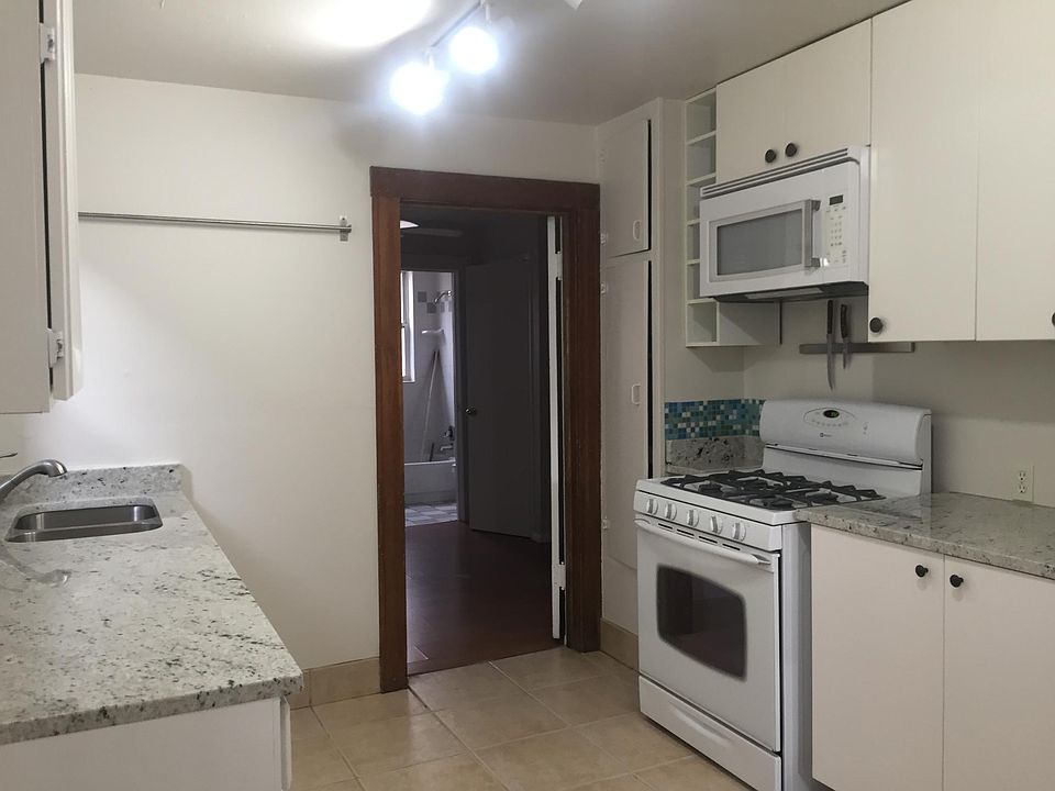 Galley kitchen with gas range/over and built in microwave