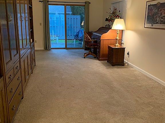 Living room w/ door to patio