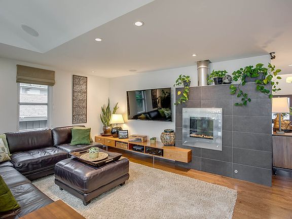 Large Living Room with Grand Views of the Lake or Enjoy the Fire or both.