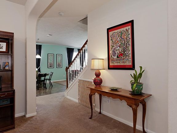 Large entry way leading into living area and kitchen.