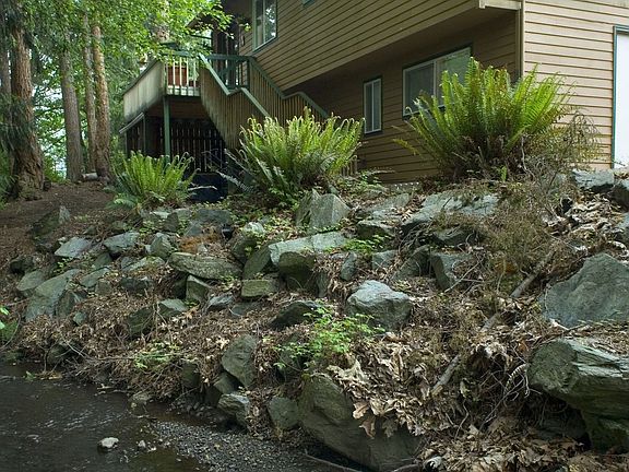 back of house with stream