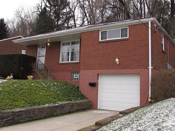 The Welcoming Long Driveway leads to the Garage which has a Brand New Door and an Opener