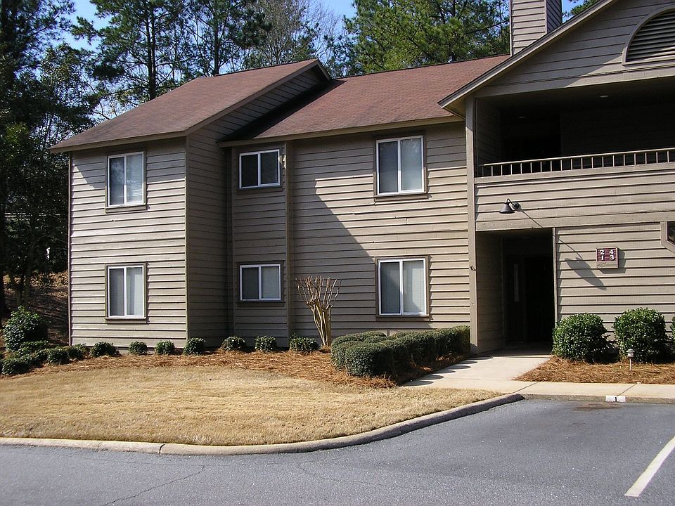 2 parking spaces at front door; 4 overflow spaces to left