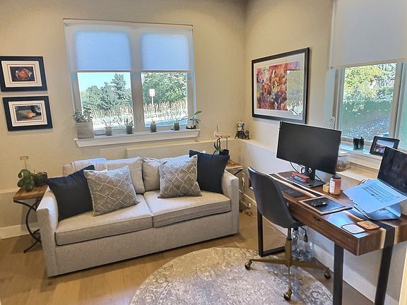 Bedroom 1: An entry level bedroom with en-suite bathroom and two closets. Couch for lounging during the workday. This room can be set up as a spare bedroom -- fold out the couch for guests. Perfect for work-from-home couples.