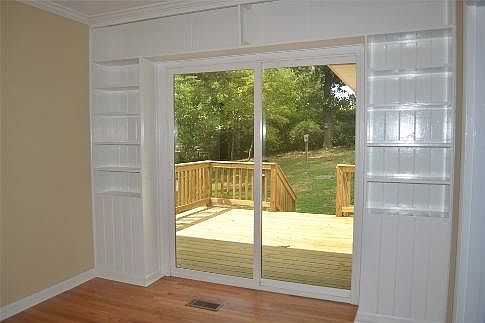 Den has new sliding glass door and access to deck