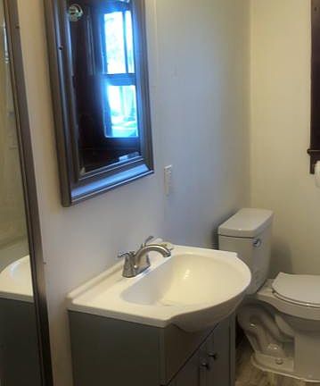 Bathroom Vanity; Has a full tub with shower