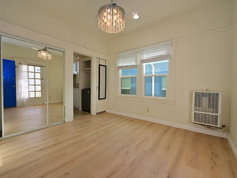 FULLY UPGRADED Studio + private balcony with Ocean view, New flooring, almost new everything, with in-unit laundry!