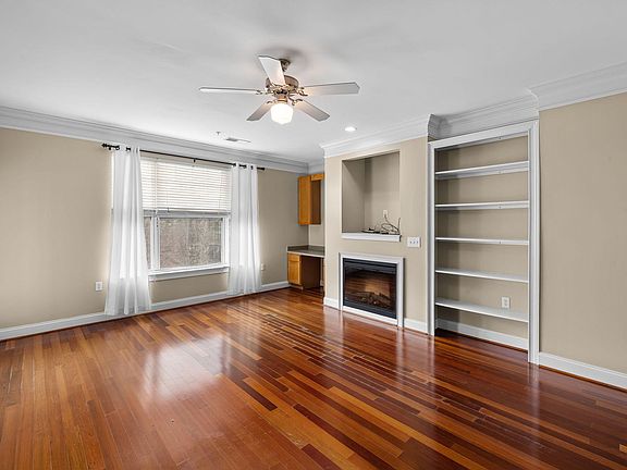 Living room, fireplace, and built-in shelves