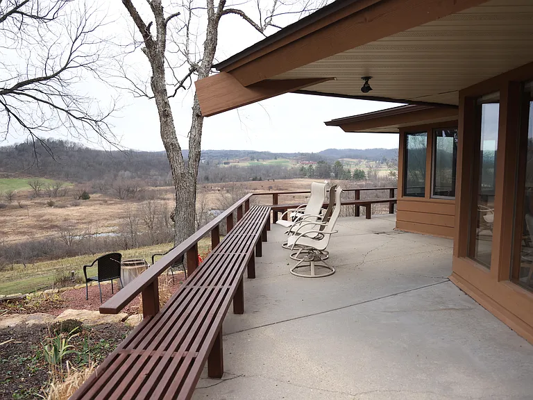 The perfect spot for morning coffee or evening relaxation, with built-in seating and sweeping countryside views.
