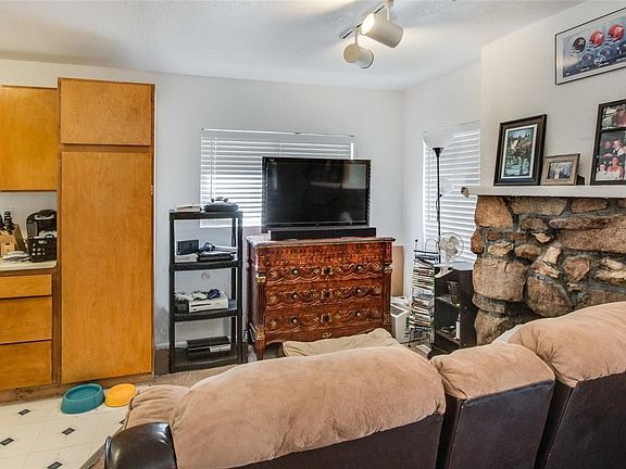 Living area off kitchen with fireplace