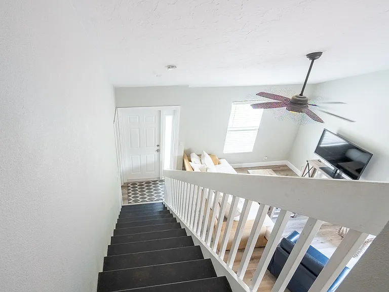 Stairs from master suite to front door