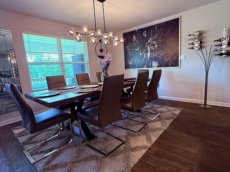 Dining area with picturesque pond and woodland views.
