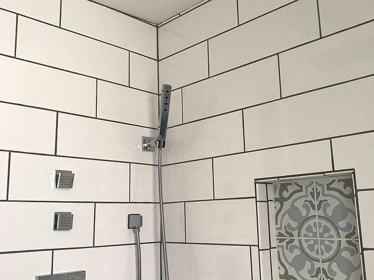 Shower with rain shower head, handheld, and body jets. Updated July 2019.